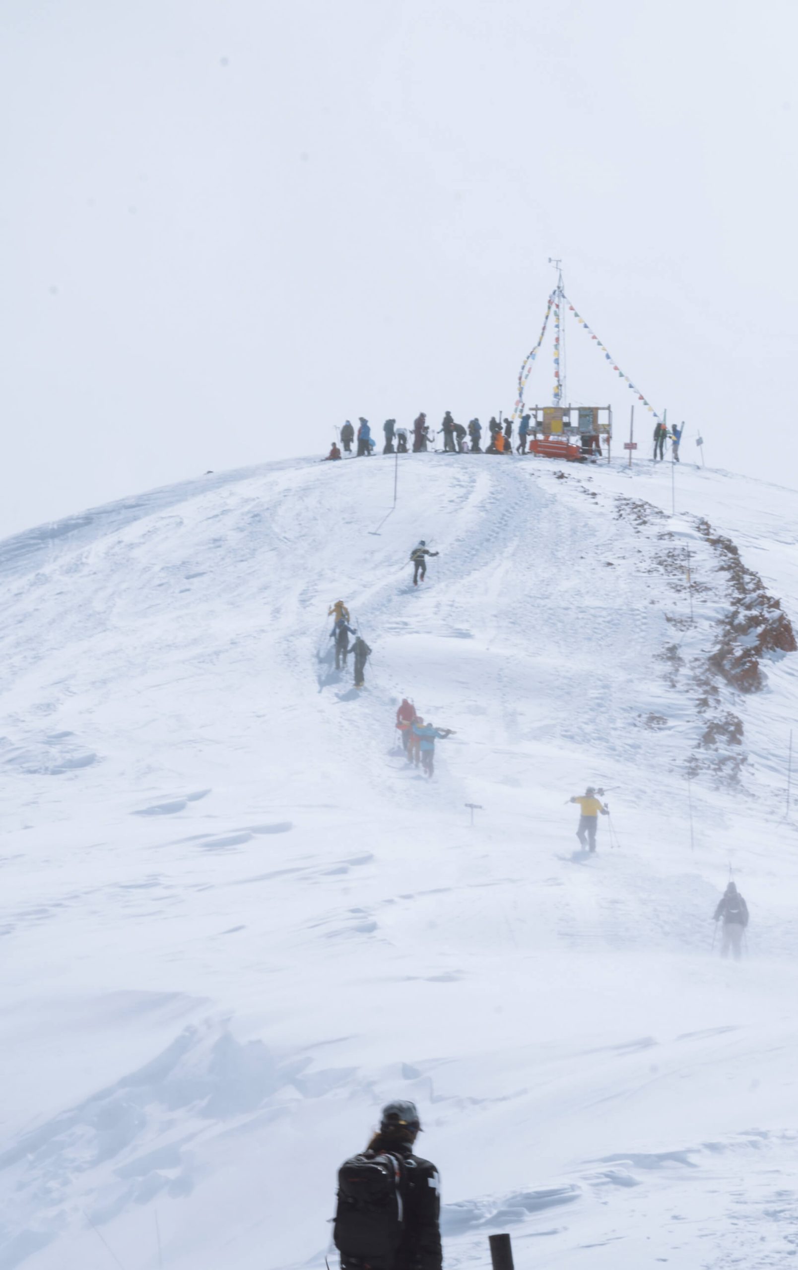 Group hikes Highlands Bowl during high winds.