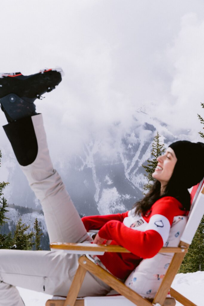 Women on mountain in ASPENX ski clothing and rental gear.