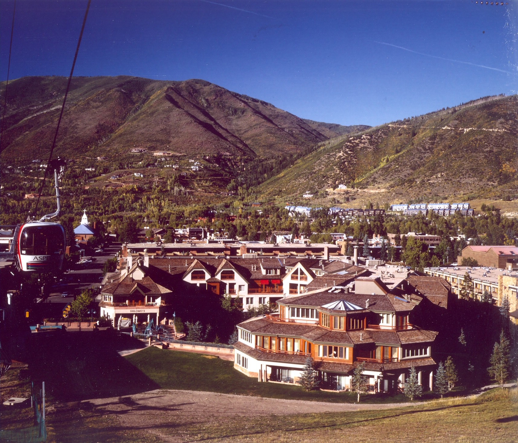 Historical image of The Little Nell in the summer with old gondola.