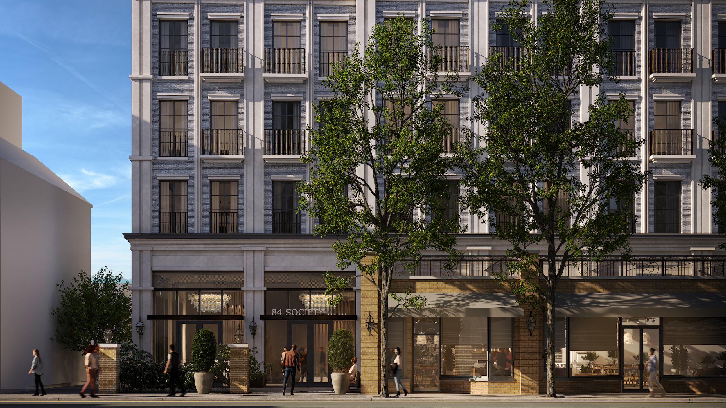 Exterior of Limelight Hotel, set to open in Charleston in 2028, grey bricks with delicate black railings, people walking on sidewalk below